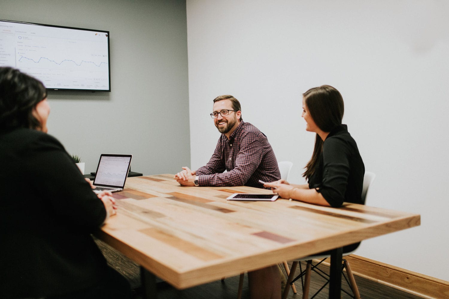 Parkway Digital team laughs at conference table in office